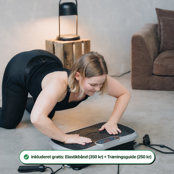 Vibrationstræner med elastikbånd i brug - inkluderet gratis elastikbånd og træningsguide